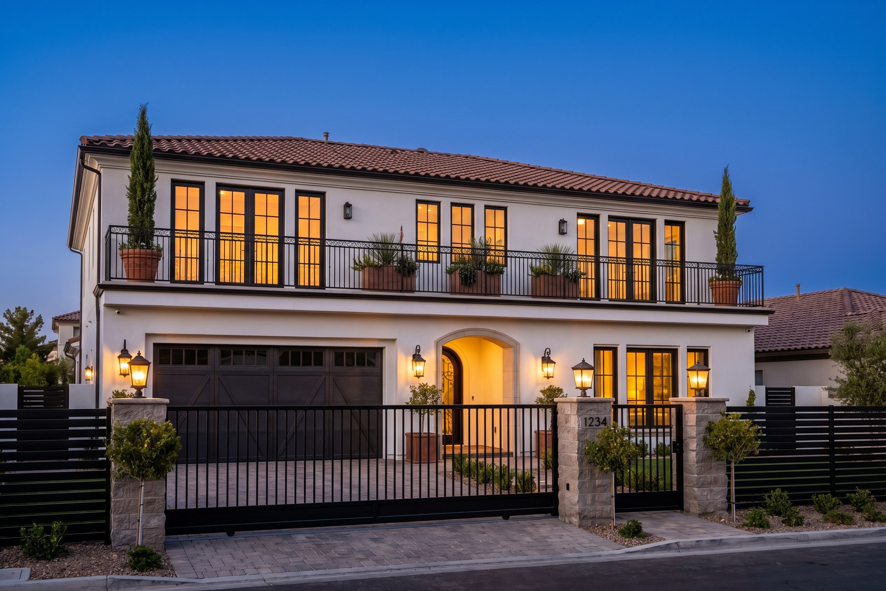 Olson Iron — custom security screens, iron gates and fencing on a Las Vegas home at dusk